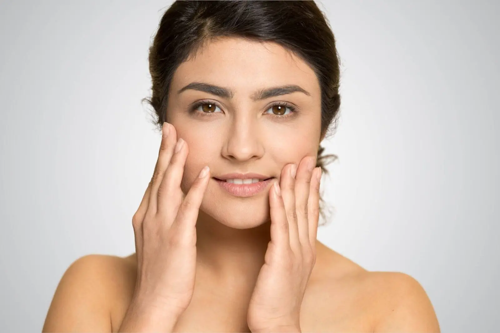 Young woman with clear skin smiling